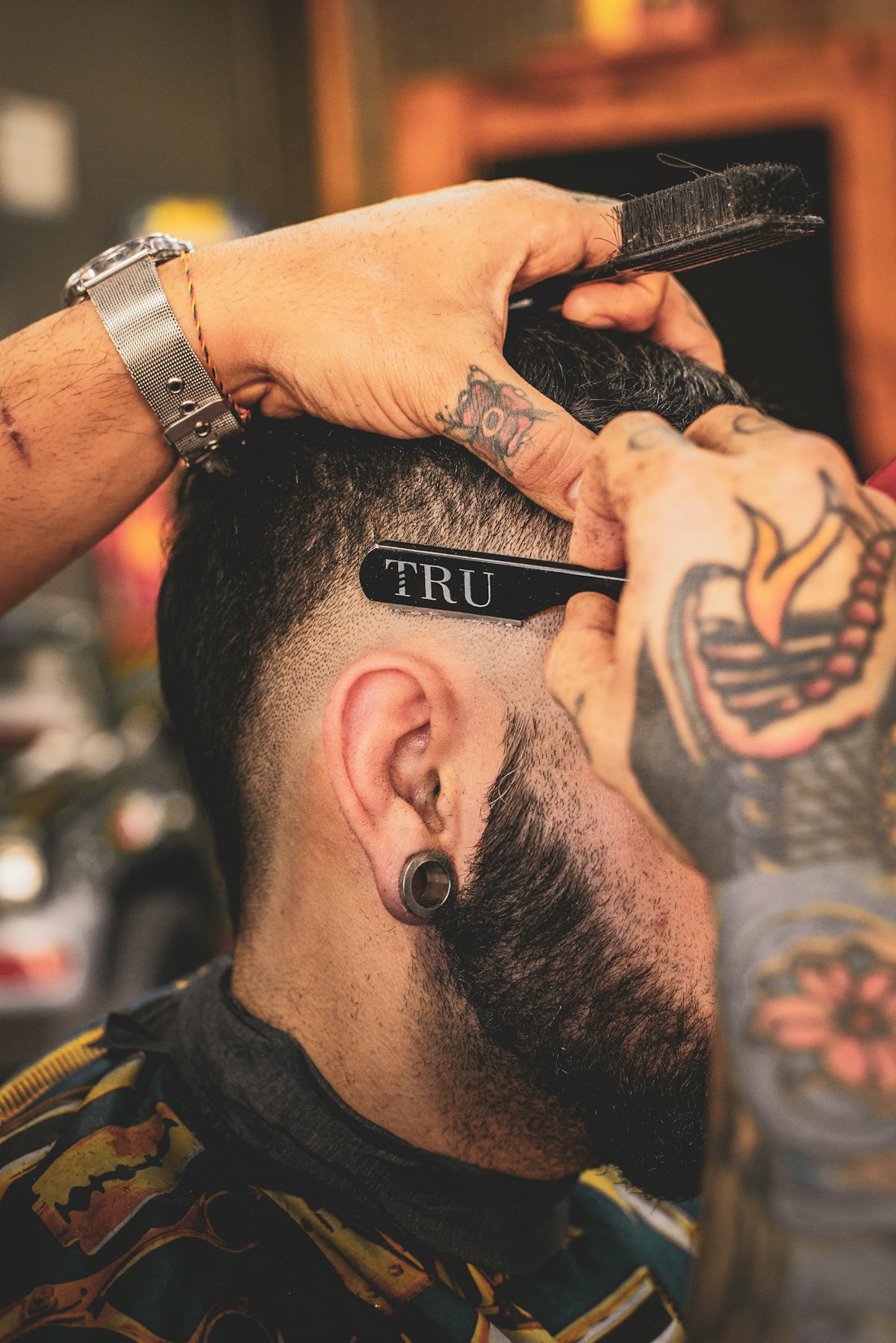 Barber analyzing a client's face shape
